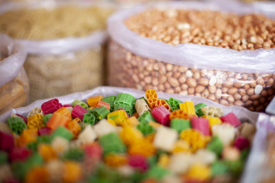 Close-up of multi colored candies for sale at market stall