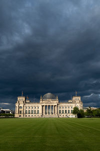 Historic building against cloudy sky