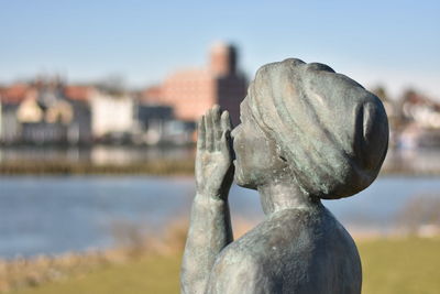 Close-up of statue against sky