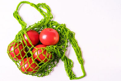 Close-up of tomatoes against white background