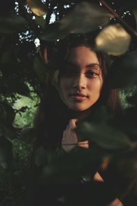 Portrait of young woman in forest