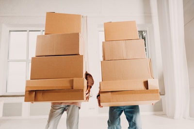 Low section of woman holding box