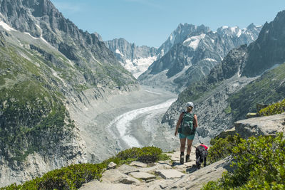 People on mountain road amidst mountains