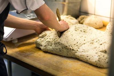 Close-up of man preparing food