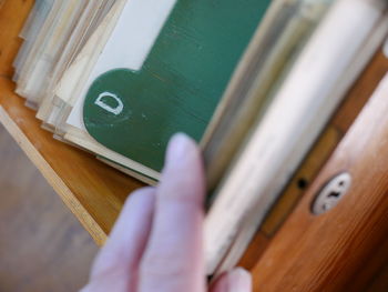 Close-up of hand holding wood