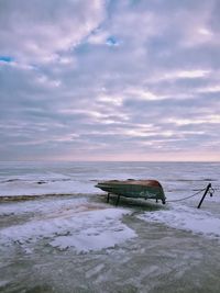 Scenic view of sea against cloudy sky