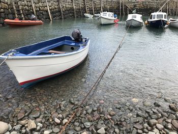 Boats moored in lake