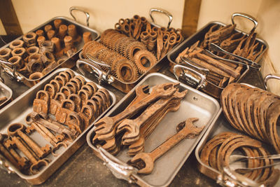 High angle view of various rusty work tools