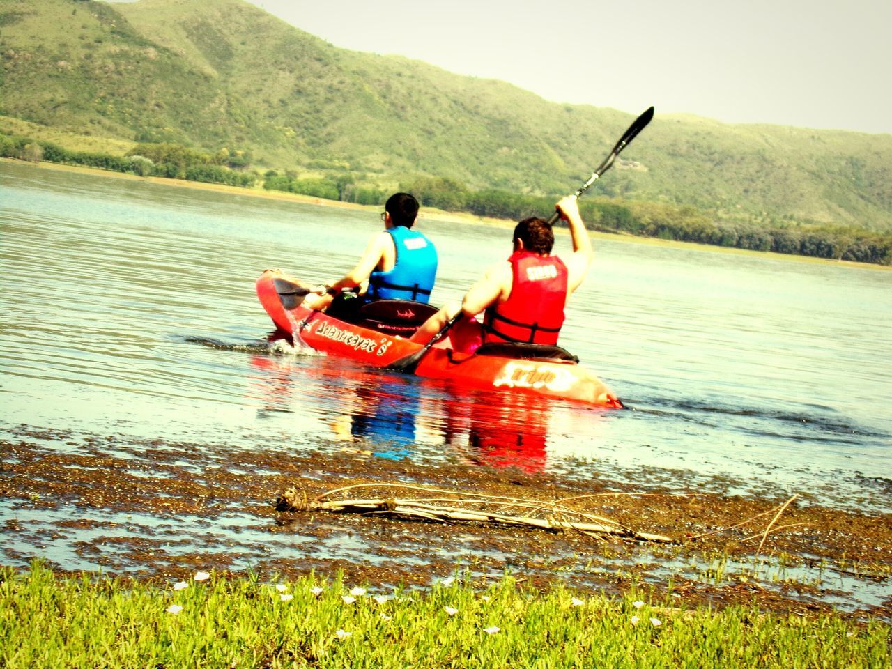 two people, kayak, leisure activity, real people, lifestyles, men, outdoors, nature, lake, nautical vessel, water, full length, togetherness, day, vacations, adventure, beauty in nature, oar, sky, adult, people, adults only