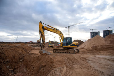 Excavator during earthmoving at construction site. backhoe dig ground for the construction 