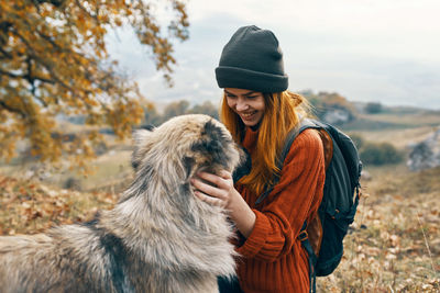 Young woman with horse in winter