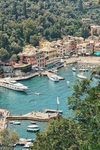 High angle view of buildings by sea