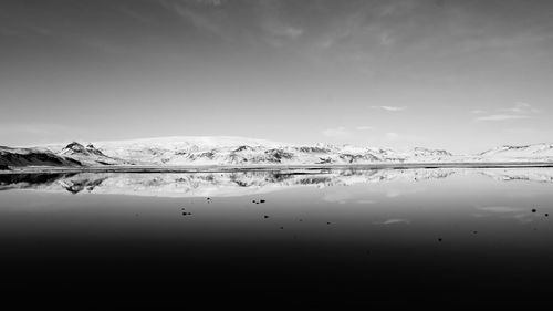 Scenic view of frozen lake against sky