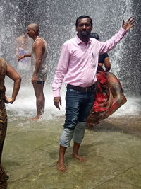 Full length of man standing in water