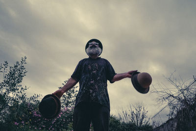 Man juggling with hats