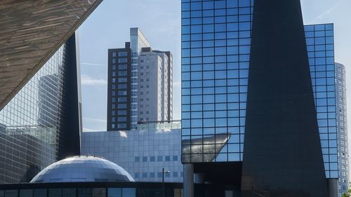 Low angle view of modern buildings in city