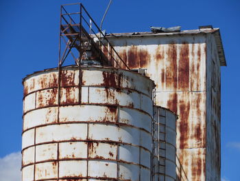 Low angle view of factory against sky