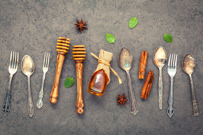 Directly above shot of spices and spoons on table