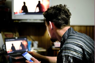 Close-up of man using mobile phone