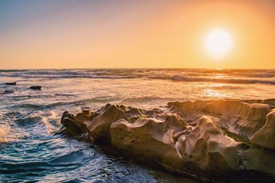 Scenic view of sea against sky during sunset