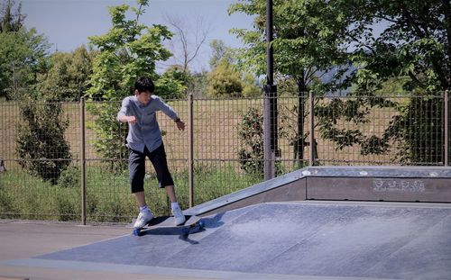 Full length of man skateboarding on skateboard