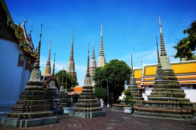 Panoramic view of temple and building against sky