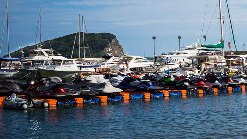 Boats moored at harbor