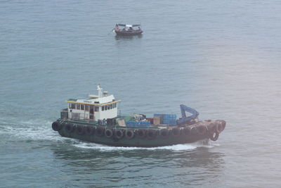 High angle view of ship sailing in sea