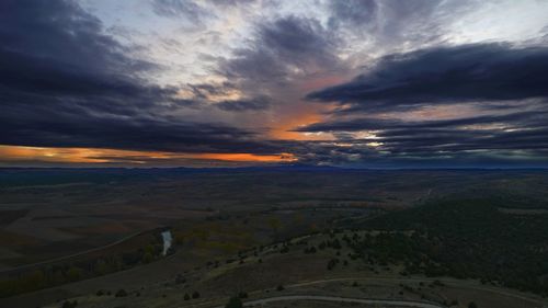 Aerial view of landscape against sky during sunset