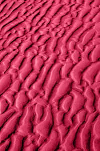 Natural sand pattern background. abstract magenta sand surface texture background.