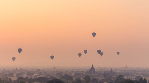 View of hot air balloons against sky during sunset