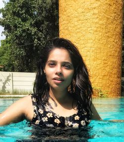 Portrait of young woman in swimming pool