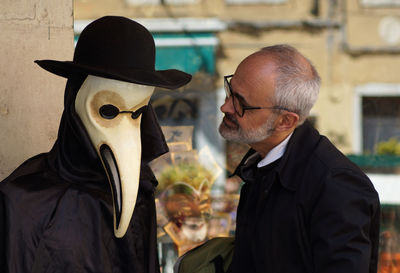 Portrait of man wearing mask