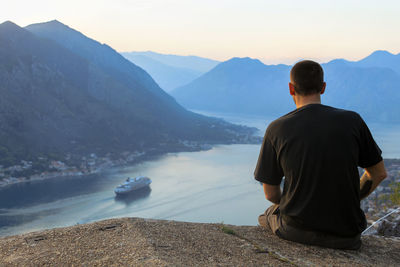 Rear view of man looking at sea