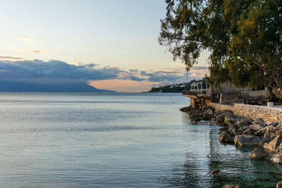 Scenic view of sea against sky at sunset