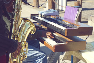 Low angle view of man playing piano