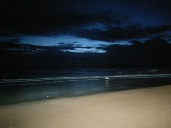 Scenic view of sea against sky at night