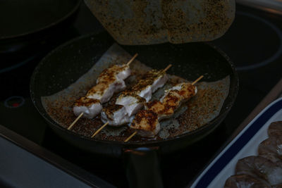 High angle view of meat on barbecue grill