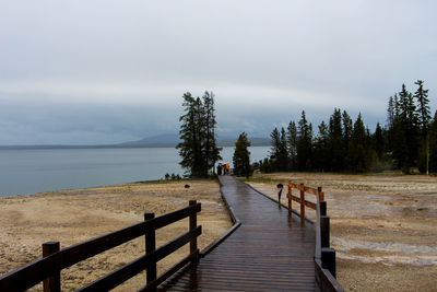 Pier over sea against sky