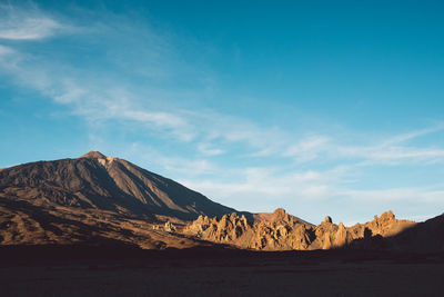 Scenic view of rocky mountains against sky