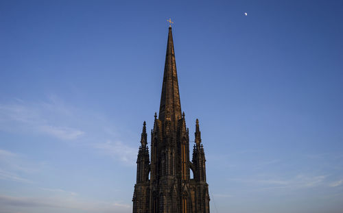 Low angle view of church against blue sky