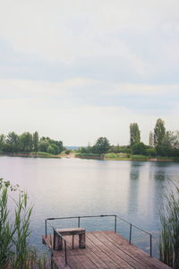 Scenic view of calm lake against sky