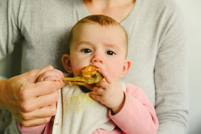 Portrait of cute boy eating food