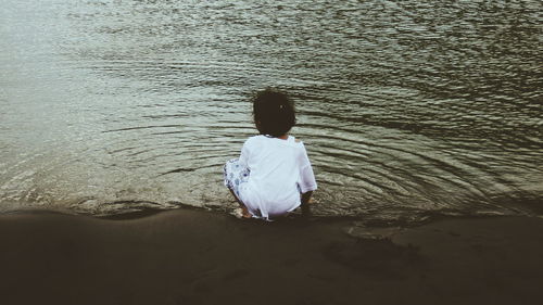 Rear view of woman on beach