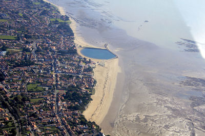 Aerial view of sea and cityscape