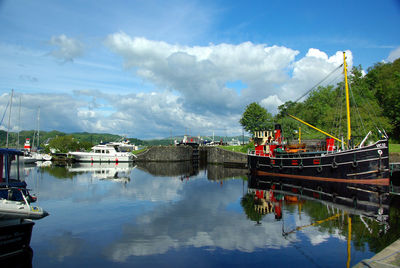 Boats moored at dock