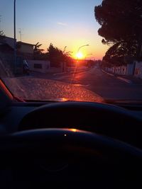 Car on road at sunset