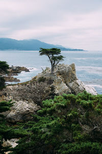 Scenic view of sea against cloudy sky