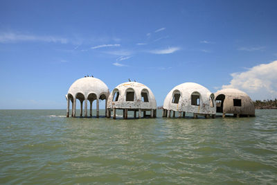 Panoramic view of sea and building against sky