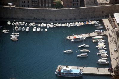 High angle view of boats moored in city